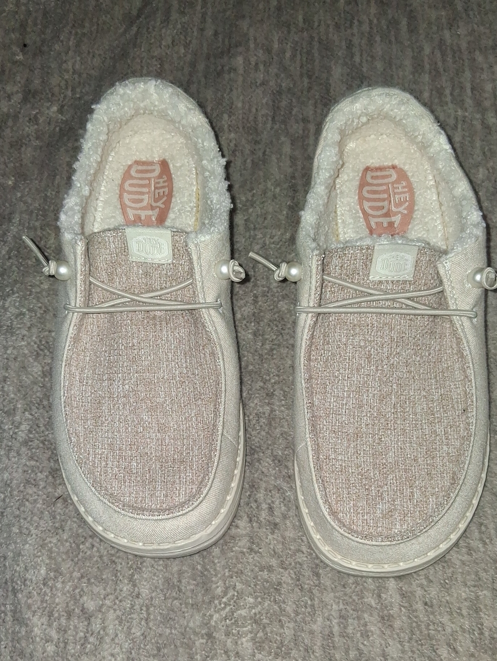 Hey Dude Womens Slip-On Loafers in Light Beige with Sherpa Lining and pearls.